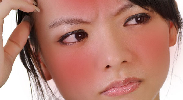 Asian girl with red face from alcohol